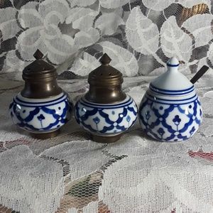 Salt and pepper shakers with matching sugar bowl